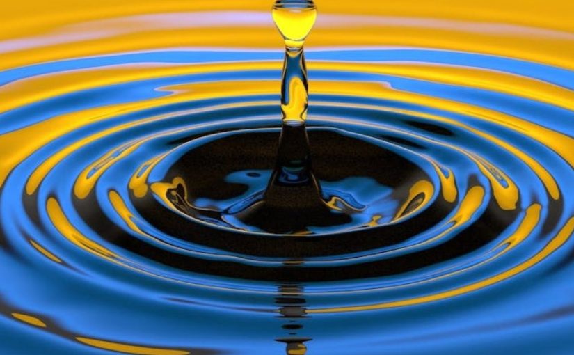 Yellow and blue bicolor image of water drop surface splash